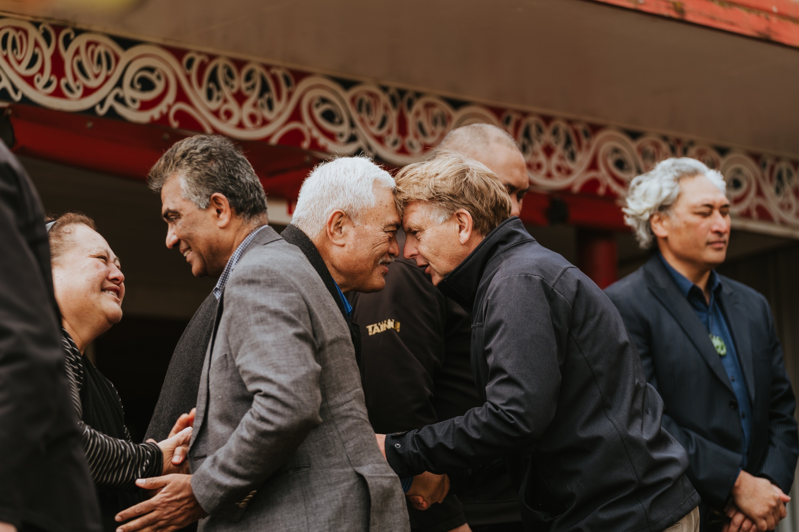 people performing the hongi