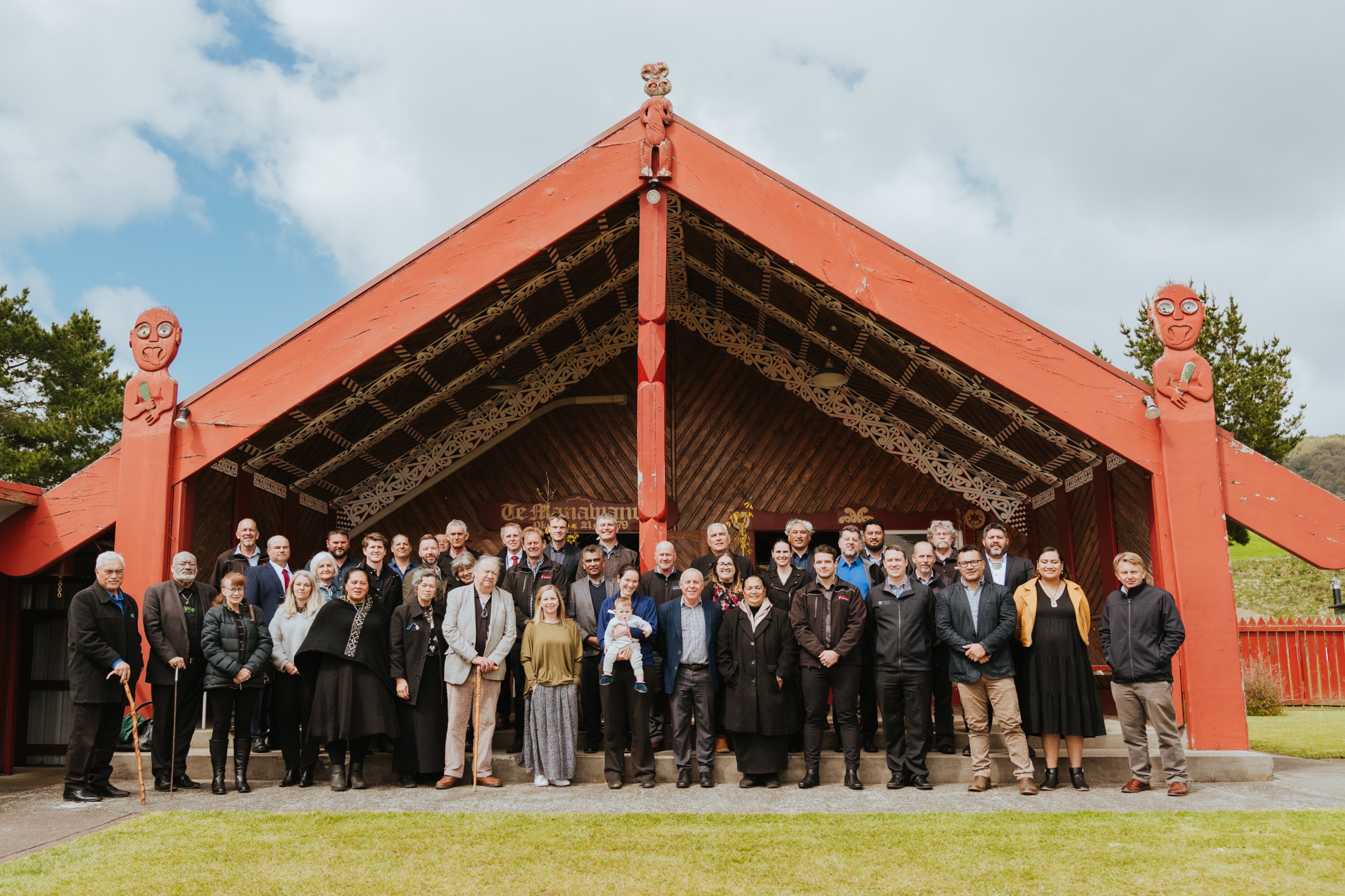 group standing in front of the marae